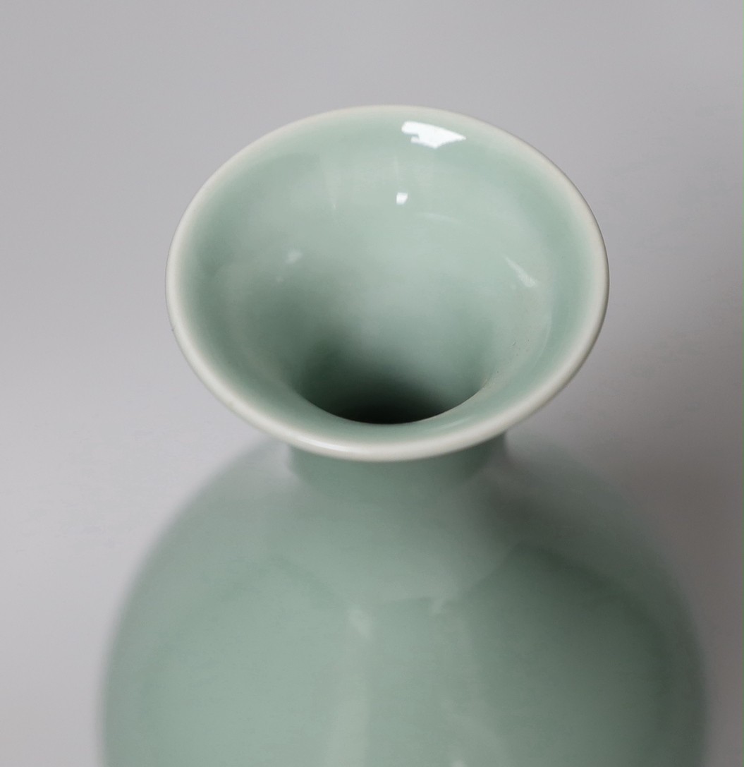 A Chinese celadon glazed vase, hallmark to base, wood stand. 24.5cm high